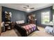 Cozy bedroom featuring a ceiling fan and a window letting in natural light at 13469 Pia Ct, Spring Hill, FL 34609