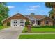 Charming brick home with two-car garage and well-manicured lawn in a suburban setting at 13469 Pia Ct, Spring Hill, FL 34609
