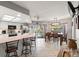 Open kitchen with white cabinets, stainless appliances, and dining area overlooking pool at 13469 Pia Ct, Spring Hill, FL 34609