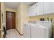 Functional laundry room with a washer and dryer, offering convenience at 13469 Pia Ct, Spring Hill, FL 34609