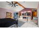 Spacious primary bedroom featuring high ceilings, a ceiling fan, and ensuite bathroom at 13469 Pia Ct, Spring Hill, FL 34609