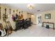Large room with tile flooring, filled with musical instruments and amplifiers at 13469 Pia Ct, Spring Hill, FL 34609