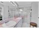 Clean bathroom featuring double sinks, tile flooring, and walk-in shower at 14105 Agua Clara Dr, Hudson, FL 34667