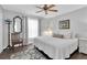 Cozy bedroom with wood floors, natural light, and neutral decor at 14105 Agua Clara Dr, Hudson, FL 34667