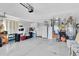 Spacious garage featuring ample storage, work area, and shelving, ideal for projects and organization at 14105 Agua Clara Dr, Hudson, FL 34667