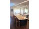 Spacious kitchen featuring a large island with seating, granite countertops, and stainless steel appliances at 14105 Agua Clara Dr, Hudson, FL 34667