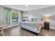 Comfortable main bedroom with large window overlooking backyard at 14105 Agua Clara Dr, Hudson, FL 34667