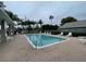 A rectangular community pool with lounge chairs is a great place to meet your neighbors at 14105 Agua Clara Dr, Hudson, FL 34667