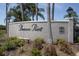 Entrance sign to Beacon Point shows lush landscaping and a well maintained community at 14105 Agua Clara Dr, Hudson, FL 34667