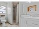 Updated bathroom with shower and modern vanity at 15535 Allmand Dr, Hudson, FL 34667