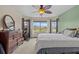 Bedroom features a bay window, light carpet and plenty of space at 15535 Allmand Dr, Hudson, FL 34667
