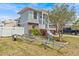 Well-manicured front yard with lush lawn, mature trees, and boat trailer parking at 15535 Allmand Dr, Hudson, FL 34667