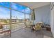 Screened patio with a dining table and chairs overlooking a waterway at 15535 Allmand Dr, Hudson, FL 34667