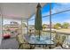 View of a screened patio with a dining table and waterway at 15535 Allmand Dr, Hudson, FL 34667