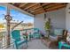 This screened-in porch with waterfront views features comfortable seating and decor at 15535 Allmand Dr, Hudson, FL 34667