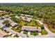 Birds eye view of the home nestled within a lush, green neighborhood setting at 18441 Whitacre Cir, Hudson, FL 34667