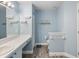 Well-lit bathroom with modern fixtures and a functional layout and light blue decor at 18441 Whitacre Cir, Hudson, FL 34667