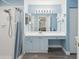 Bright bathroom with a shower, vanity, and view into the Primary bedroom at 18441 Whitacre Cir, Hudson, FL 34667