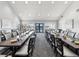 Spacious dining room with ample seating for large gatherings and bright natural light from large windows at 18441 Whitacre Cir, Hudson, FL 34667