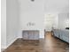 Inviting entryway featuring wood floors and a decorative console table with natural light at 18441 Whitacre Cir, Hudson, FL 34667