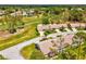 Charming single-story home with well-maintained landscaping and a screened in lanai in a desirable 55+ community at 18441 Whitacre Cir, Hudson, FL 34667