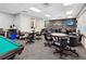 Game room with pool table and tables, offering recreational opportunities for residents and guests at 18441 Whitacre Cir, Hudson, FL 34667