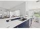 Bright kitchen featuring white countertops, stainless steel appliances and a large sink at 18441 Whitacre Cir, Hudson, FL 34667