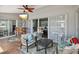 Cozy lanai with comfortable seating, mounted TV, and bar area, perfect for entertaining at 18441 Whitacre Cir, Hudson, FL 34667