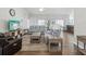 Open living area showcases a comfortable seating arrangement, TV, and an open concept design at 18441 Whitacre Cir, Hudson, FL 34667