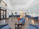 Elegant lobby featuring comfortable seating, neutral colors, modern decor, and ample natural light at 18441 Whitacre Cir, Hudson, FL 34667