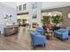 Cozy lobby featuring comfortable seating near a fireplace, light-colored walls, and attractive decor at 18441 Whitacre Cir, Hudson, FL 34667