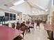 Large meeting room with tables and chairs, providing ample space for community events and gatherings at 18441 Whitacre Cir, Hudson, FL 34667