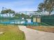 Enclosed pickleball courts with green fencing, offering a recreational space for community members to enjoy at 18441 Whitacre Cir, Hudson, FL 34667