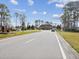 Well-maintained community entrance with lush landscaping and security gate for peace of mind and convenience at 18441 Whitacre Cir, Hudson, FL 34667