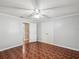 Bright bedroom with a ceiling fan, closet and neutral walls and flooring at 196 Lark Ave, Brooksville, FL 34601