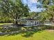 View of the house and an adjacent carport at 196 Lark Ave, Brooksville, FL 34601