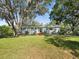 Charming single-story home with a well-maintained lawn, mature trees, and updated windows at 196 Lark Ave, Brooksville, FL 34601