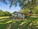 Charming home with a well-maintained lawn and mature trees at 196 Lark Ave, Brooksville, FL 34601