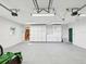 The clean garage features white walls, cabinets, and plenty of storage space at 196 Lark Ave, Brooksville, FL 34601
