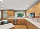 Well-equipped kitchen with granite countertops, stainless steel appliances, and ample cabinet space at 196 Lark Ave, Brooksville, FL 34601