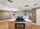 Kitchen with modern oven and stovetop, white countertops, and breakfast bar at 196 Lark Ave, Brooksville, FL 34601