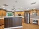 Spacious kitchen with wooden cabinetry, stainless steel appliances, and ample counter space at 196 Lark Ave, Brooksville, FL 34601