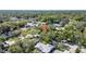 An aerial view reveals the property's location within a leafy neighborhood with mature trees at 2116 Karan Way, Clearwater, FL 33763