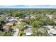 An aerial shot showing a lovely home in a quiet neighborhood with mature trees at 2116 Karan Way, Clearwater, FL 33763