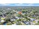 Overhead drone shot of the property showing its setting within the neighborhood, with mature trees surrounding it at 2116 Karan Way, Clearwater, FL 33763