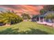 Expansive backyard offering plenty of space for outdoor activities and featuring lush greenery, and privacy fence at 2116 Karan Way, Clearwater, FL 33763