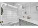 Well-lit bathroom with stylish vanity, shower, and modern fixtures at 2116 Karan Way, Clearwater, FL 33763