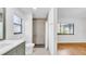 Modern bathroom showcasing updated fixtures, sleek vanity, and glass-enclosed shower at 2116 Karan Way, Clearwater, FL 33763