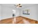 Inviting bedroom with hardwood floors and access to an ensuite bathroom at 2116 Karan Way, Clearwater, FL 33763
