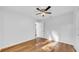 Bright bedroom with wood flooring, white walls and ceiling fan for comfortable living at 2116 Karan Way, Clearwater, FL 33763